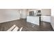 Open-concept kitchen with a center island and stainless steel appliances at 17717 E 54Th Ave, Denver, CO 80249