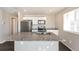 Kitchen island with granite countertops and stainless steel appliances at 17717 E 54Th Ave, Denver, CO 80249