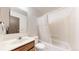 Bright bathroom featuring a shower-tub combo with curtain and a single sink vanity at 381 S Estes St # 1, Lakewood, CO 80226