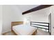 Cozy bedroom with natural wood accents, white walls, and a bright window offering a welcoming retreat at 381 S Estes St # 1, Lakewood, CO 80226