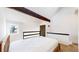 Comfortable bedroom featuring natural wood, black accents, and a window, providing a calming space at 381 S Estes St # 1, Lakewood, CO 80226