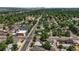 Wide aerial view of a residential area with tree-lined streets towards the city skyline at 3306 S Logan St, Englewood, CO 80113