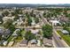 Scenic aerial view of neighborhood streets, lush trees, and city skyline with mountain backdrop at 3306 S Logan St, Englewood, CO 80113