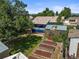 This charming backyard features a greenhouse, raised garden beds, and a covered porch at 3306 S Logan St, Englewood, CO 80113