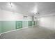 The finished basement offers versatile space with paneled walls and unique shelving at 3306 S Logan St, Englewood, CO 80113