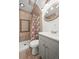 This charming bathroom features a tile shower, a neutral vanity, and new fixtures at 3306 S Logan St, Englewood, CO 80113