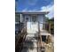 A charming entryway with wooden steps and railing leads to the front door of this home at 3306 S Logan St, Englewood, CO 80113