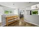 Bright kitchen with a decorative island, tile flooring and a view to the dining area at 3306 S Logan St, Englewood, CO 80113