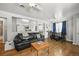 This living room features hardwood floors, ceiling fan and an open floor plan at 3306 S Logan St, Englewood, CO 80113