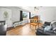 This living room features a large window, hardwood floors and plenty of space at 3306 S Logan St, Englewood, CO 80113