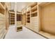 Spacious walk-in closet features built in shelves and drawers for optimal storage at 1328 E Layton Ave, Cherry Hills Village, CO 80113