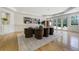 This elegant dining room features hardwood floors, wainscoting, and plenty of natural light at 1328 E Layton Ave, Cherry Hills Village, CO 80113