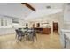 Gourmet kitchen with custom cabinets, island, and dining area at 1328 E Layton Ave, Cherry Hills Village, CO 80113