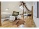 Large living room featuring hard wood floors, exposed wooden beams, and an upper level view at 1328 E Layton Ave, Cherry Hills Village, CO 80113