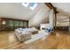 Living room boasts stone fireplace, skylights, built-in bookshelves, and comfortable seating at 1328 E Layton Ave, Cherry Hills Village, CO 80113
