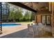 View of a beautiful backyard patio with an in-ground pool and spiral staircase at 1328 E Layton Ave, Cherry Hills Village, CO 80113