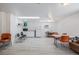 Community room with tables, chairs, and kitchenette at 7995 E Mississippi Ave # G5, Denver, CO 80247
