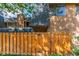 Townhome exterior with wooden fence and gate at 7995 E Mississippi Ave # G5, Denver, CO 80247