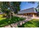 Community building with a pool and surrounding landscaping at 7995 E Mississippi Ave # G5, Denver, CO 80247