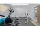 Community fitness center with elliptical and weight bench at 7995 E Mississippi Ave # G5, Denver, CO 80247
