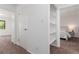 Bright hallway with built-in shelving and access to bedroom at 7995 E Mississippi Ave # G5, Denver, CO 80247