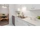 Modern kitchen with white cabinets and stainless steel appliances at 7995 E Mississippi Ave # G5, Denver, CO 80247