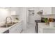 Modern kitchen with stainless steel appliances and white cabinets at 7995 E Mississippi Ave # G5, Denver, CO 80247