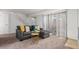 Cozy living room featuring a gray sectional sofa and access to a patio at 7995 E Mississippi Ave # G5, Denver, CO 80247