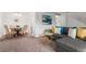 Bright living room with gray sectional sofa and dining area at 7995 E Mississippi Ave # G5, Denver, CO 80247