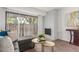 Living room with gray sectional sofa, fireplace, and patio access at 7995 E Mississippi Ave # G5, Denver, CO 80247