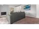 Living room with gray sofa, fireplace, and artwork at 7995 E Mississippi Ave # G5, Denver, CO 80247