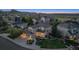 Aerial view of a beautiful suburban home with landscaped yard, and a view of the neighborhood at 9375 S Hoyt Ct, Littleton, CO 80127