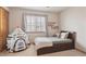 Cozy bedroom with a fun rocket tent, natural light and comfortable furniture at 9375 S Hoyt Ct, Littleton, CO 80127