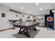 Game room featuring a ping pong table, bar seating and a putting green at 9375 S Hoyt Ct, Littleton, CO 80127