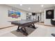 Game room featuring a ping pong table, dart board and a home gym at 9375 S Hoyt Ct, Littleton, CO 80127