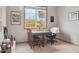 Cozy home office with natural light, a neutral color palette, and a view to the outdoors at 9375 S Hoyt Ct, Littleton, CO 80127