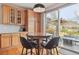 Eat-in kitchen with wood cabinets, hardwood floors, and a view of the outdoor patio at 9375 S Hoyt Ct, Littleton, CO 80127