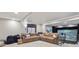 Spacious living room with a comfortable sectional sofa, media center and a window at 9375 S Hoyt Ct, Littleton, CO 80127
