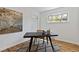 Home office featuring a wooden desk, hardwood floors, area rug, and natural light from a window at 4550 Zephyr St, Wheat Ridge, CO 80033