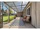 Covered patio with outdoor seating, area rug, view of the backyard, and transparent awning above at 4550 Zephyr St, Wheat Ridge, CO 80033