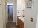 Bathroom features a double sink vanity, framed mirror, and colorful shower curtain at 2240 S Pagosa Ct # B, Aurora, CO 80013