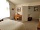 An airy bedroom boasts natural light from a large window and a desk for working or studying at 2240 S Pagosa Ct # B, Aurora, CO 80013