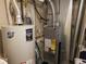 Image shows a furnace and hot water heater in the basement at 2240 S Pagosa Ct # B, Aurora, CO 80013