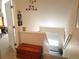 An upstairs hallway featuring wood chest, paper cranes and a window with sunlight streaming in at 2240 S Pagosa Ct # B, Aurora, CO 80013