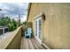 Open-air balcony with a chair and view of backyard at 2479 S High St, Denver, CO 80210