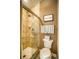 Shower with glass door and toilet are featured in the bathroom at 2479 S High St, Denver, CO 80210