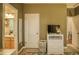 A cozy bedroom with a dresser and a connecting bathroom at 2479 S High St, Denver, CO 80210