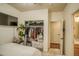 A bedroom with a closet, tv and a connected bathroom at 2479 S High St, Denver, CO 80210