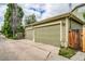 Spacious two car garage with concrete driveway, close to the backyard of the home at 2479 S High St, Denver, CO 80210