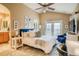 Spacious main bedroom with vaulted ceiling, ensuite bathroom, and private balcony at 2479 S High St, Denver, CO 80210
